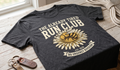 The Already Tired Run Club T-Shirt – Funny Running Shirt with Sunflower & No Urgency Slogan